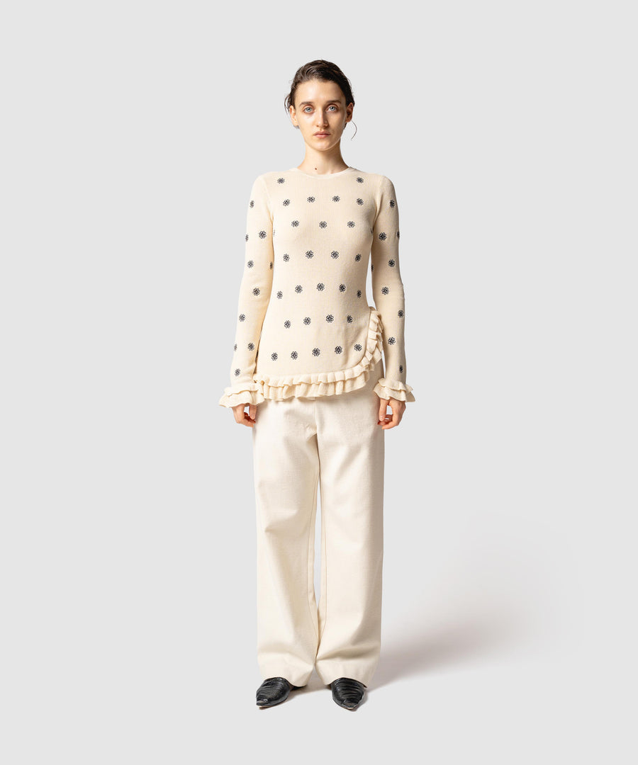 CREST EMBROIDERY FRILLED TOP